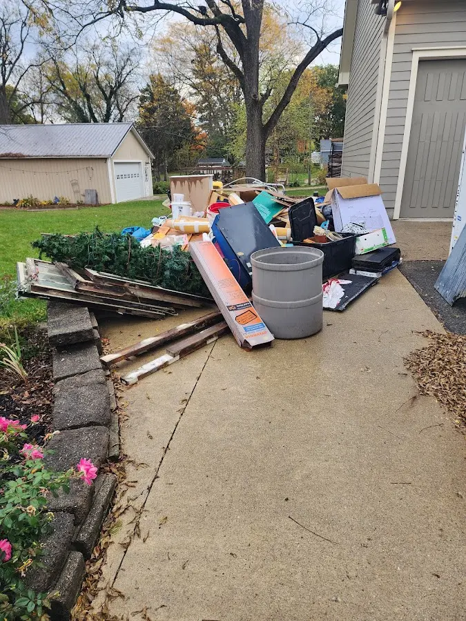 Dumpster being loaded with debris for 3 Yard Dumpster Rental in Goose Creek